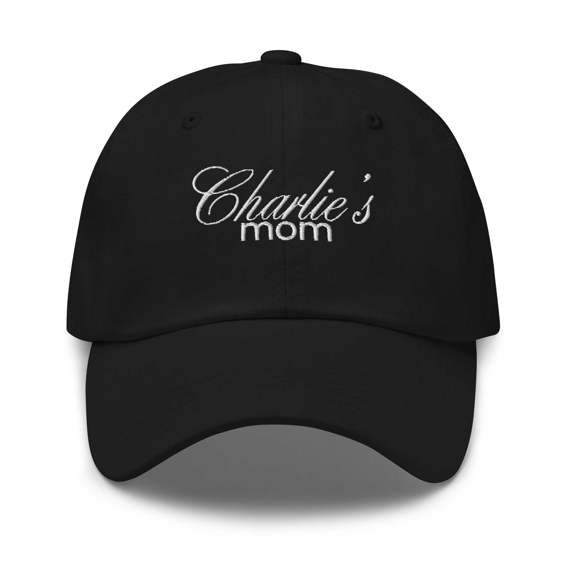 Black baseball cap featuring white embroidered text Charlie's mom in a decorative script font above a simpler sans-serif font highlighting the fabric texture and stitching details